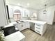 Well lit kitchen features modern appliances, island, white cabinetry and backsplash at 20917 N 37Th Pl, Phoenix, AZ 85050