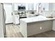 Modern kitchen features white cabinetry, stainless steel appliances, and sleek countertops at 20917 N 37Th Pl, Phoenix, AZ 85050