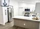 Bright kitchen with modern cabinets, stainless appliances, and quartz countertops at 20917 N 37Th Pl, Phoenix, AZ 85050