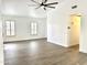Bright living room features wood-look floors, white walls, and large windows at 20917 N 37Th Pl, Phoenix, AZ 85050