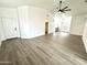 Spacious living room with wood-look floors, white walls and natural light at 20917 N 37Th Pl, Phoenix, AZ 85050