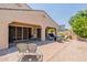 Spacious backyard patio with outdoor seating and a well-maintained lawn, great for gatherings at 22851 S 229Th Pl, Queen Creek, AZ 85142