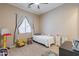 Cozy bedroom with carpeted floors, soft natural light, and comfortable furnishing at 22851 S 229Th Pl, Queen Creek, AZ 85142