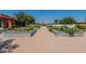 Community garden featuring raised garden beds with plants and shaded seating areas at 22851 S 229Th Pl, Queen Creek, AZ 85142