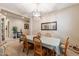 Traditional dining room featuring a long table for six and classic furnishings, ideal for hosting gatherings at 22851 S 229Th Pl, Queen Creek, AZ 85142