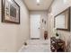 Neutral-toned entryway featuring tile floors, a console table, and decorative wall art at 22851 S 229Th Pl, Queen Creek, AZ 85142