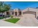 Charming single-story home with a two-car garage, landscaped front yard and welcoming front porch at 22851 S 229Th Pl, Queen Creek, AZ 85142