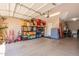 Well-organized garage with ample storage shelves and space for vehicles and tools at 22851 S 229Th Pl, Queen Creek, AZ 85142