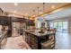 Gourmet kitchen with stainless steel appliances, granite countertops and an adjacent dining area for six at 22851 S 229Th Pl, Queen Creek, AZ 85142