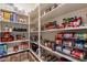 Well-organized pantry with ample shelving, perfect for storing groceries and household essentials at 22851 S 229Th Pl, Queen Creek, AZ 85142