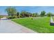 Community park featuring green grass, shaded seating areas, and walking paths at 22851 S 229Th Pl, Queen Creek, AZ 85142