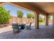 Covered patio with comfortable seating area, ideal for outdoor relaxation and entertaining guests at 22851 S 229Th Pl, Queen Creek, AZ 85142