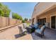 Inviting backyard patio featuring stylish seating arrangements and a well-maintained outdoor space at 22851 S 229Th Pl, Queen Creek, AZ 85142