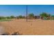 Climbing structure and landscaped community playground with wood chip ground cover at 22851 S 229Th Pl, Queen Creek, AZ 85142