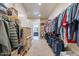 Large walk-in closet with plenty of storage space and easy access to the bathroom at 22851 S 229Th Pl, Queen Creek, AZ 85142