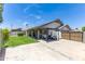 Spacious backyard with a large patio, lush green lawn, and ample space for outdoor activities at 3611 E Dartmouth Cir, Mesa, AZ 85205