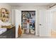 This Bedroom closet features baby clothes and other organized items at 3611 E Dartmouth Cir, Mesa, AZ 85205