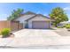 Charming single-story home showcasing a well-maintained front yard and a convenient two-car garage at 3611 E Dartmouth Cir, Mesa, AZ 85205
