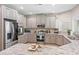 Bright kitchen featuring stone countertops, stainless appliances, and beautiful neutral cabinets at 3611 E Dartmouth Cir, Mesa, AZ 85205