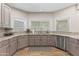 Kitchen featuring granite countertops, stainless appliances, and lots of cabinets at 3611 E Dartmouth Cir, Mesa, AZ 85205