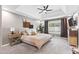 Spacious main bedroom with tray ceiling, ceiling fan, and neutral carpet at 3611 E Dartmouth Cir, Mesa, AZ 85205