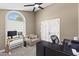 Bright home office featuring a desk, a couch, a ceiling fan, and lots of natural light at 3611 E Dartmouth Cir, Mesa, AZ 85205