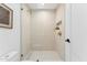 Shower with sleek glass door, a built-in niche, and modern fixtures at 3800 E Lincoln Dr # 54, Phoenix, AZ 85018