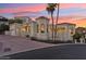 Exterior shot showcasing the architecture and landscaping of the residence with a view of the garage at 3800 E Lincoln Dr # 54, Phoenix, AZ 85018