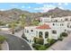Elegant Mediterranean-style home with red tile roof and mountain views surrounded by beautiful garden at 3800 E Lincoln Dr # 54, Phoenix, AZ 85018