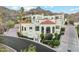 Elegant multi-level home featuring a red tile roof and a well-manicured lawn in a beautiful neighborhood at 3800 E Lincoln Dr # 54, Phoenix, AZ 85018