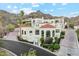 Beautiful home with red tile roofing, picturesque desert views, and pristine landscaping at 3800 E Lincoln Dr # 54, Phoenix, AZ 85018