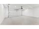 Spacious three-car garage with a clean, epoxy-coated floor and ample storage space at 3800 E Lincoln Dr # 54, Phoenix, AZ 85018