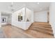 Spacious hallway featuring hardwood floors, recessed lighting, and a decorative stone-walled atrium bringing the outdoors in at 3800 E Lincoln Dr # 54, Phoenix, AZ 85018