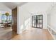 Hallway with wood floors and natural light offers ample storage with custom cabinets and a view to the outside at 3800 E Lincoln Dr # 54, Phoenix, AZ 85018