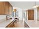 Modern kitchen boasts granite countertops, stainless steel appliances, and wood cabinets with breakfast nook at 3800 E Lincoln Dr # 54, Phoenix, AZ 85018