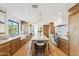 Spacious kitchen featuring a large island, stainless steel appliances, and light wood cabinetry at 3800 E Lincoln Dr # 54, Phoenix, AZ 85018