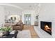 Bright living room with fireplace, wine cellar, and access to the dining area boasts great natural light at 3800 E Lincoln Dr # 54, Phoenix, AZ 85018