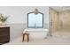Bright bathroom featuring a soaking tub and walk-in shower for a luxurious, spa-like retreat at 3800 E Lincoln Dr # 54, Phoenix, AZ 85018