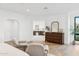 Bright main bedroom featuring hardwood floors, a dresser, and seating for relaxing at 3800 E Lincoln Dr # 54, Phoenix, AZ 85018