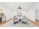 Bright main bedroom featuring wood floors, recessed lighting, a ceiling fan, and wet bar for a relaxing, serene space at 3800 E Lincoln Dr # 54, Phoenix, AZ 85018