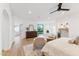 Bright main bedroom with a fireplace, seating area, and a spa-like ensuite bathroom for ultimate relaxation at 3800 E Lincoln Dr # 54, Phoenix, AZ 85018