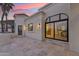 Outdoor patio showcasing tile flooring and large windows to the interior of the house at 3800 E Lincoln Dr # 54, Phoenix, AZ 85018