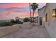 Spacious outdoor patio area featuring tile flooring, built-in grill, and desert views at 3800 E Lincoln Dr # 54, Phoenix, AZ 85018