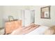 Cozy bedroom featuring a dresser with mirrors and a doorway leading to another room at 3828 N Rosewood Ave, Avondale, AZ 85392