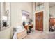 Bright foyer with a decorative table and a tall ceiling that creates an open and airy feel at 3828 N Rosewood Ave, Avondale, AZ 85392