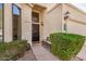 Inviting front entrance with a decorative door, sleek bench, and neat landscaping for curb appeal at 3828 N Rosewood Ave, Avondale, AZ 85392