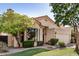 Charming single-story home features a well-manicured lawn, mature landscaping, and a cozy front porch at 3828 N Rosewood Ave, Avondale, AZ 85392