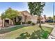 Charming home with well-manicured front lawn and mature trees at 3828 N Rosewood Ave, Avondale, AZ 85392