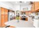 Bright kitchen featuring stainless steel refrigerator, cabinets, and tiled floors at 3828 N Rosewood Ave, Avondale, AZ 85392