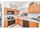 Kitchen with window view, stainless steel appliances and breakfast bar at 3828 N Rosewood Ave, Avondale, AZ 85392